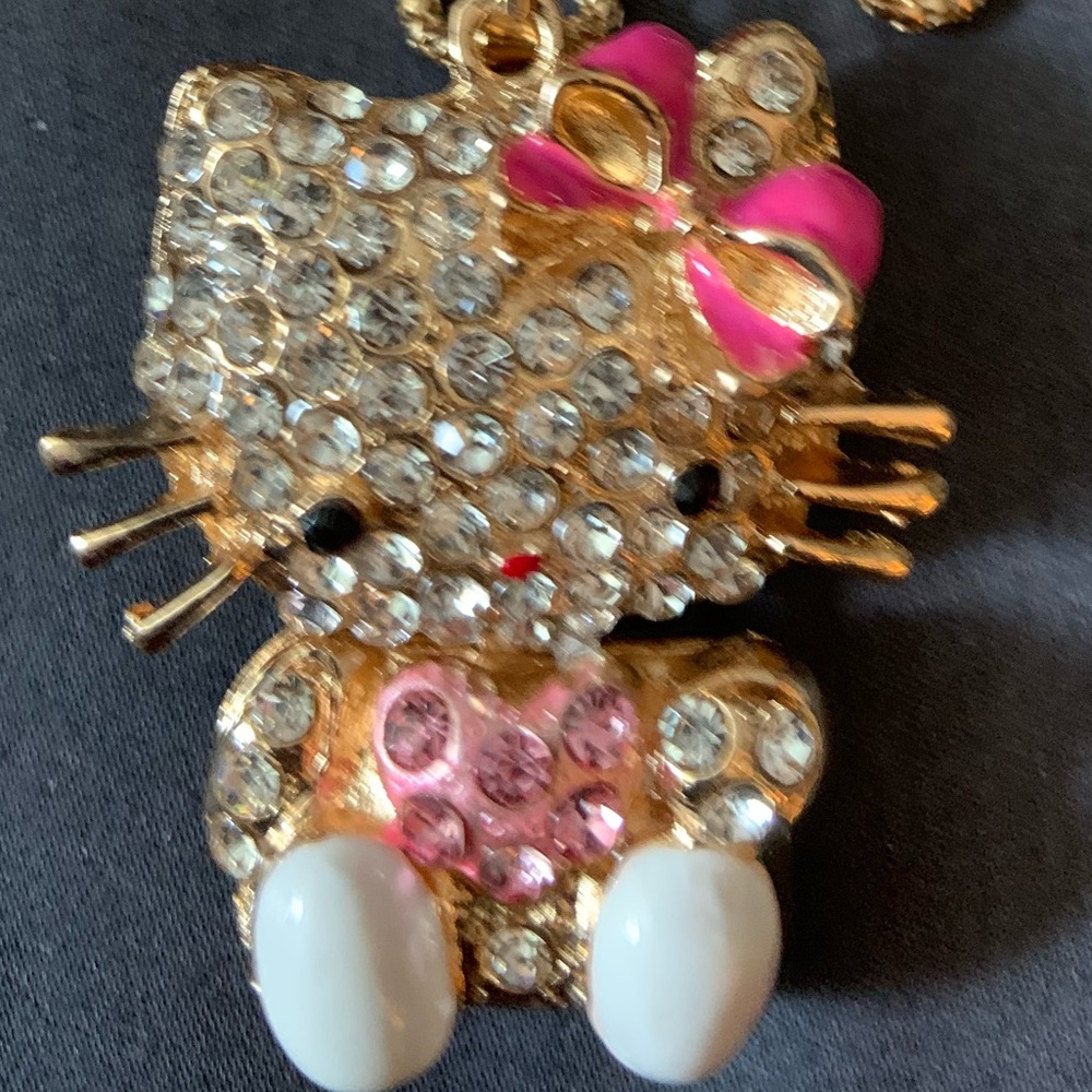 BJ pink/silver Hello Kitty necklace.  The necklace is double sided for strength.